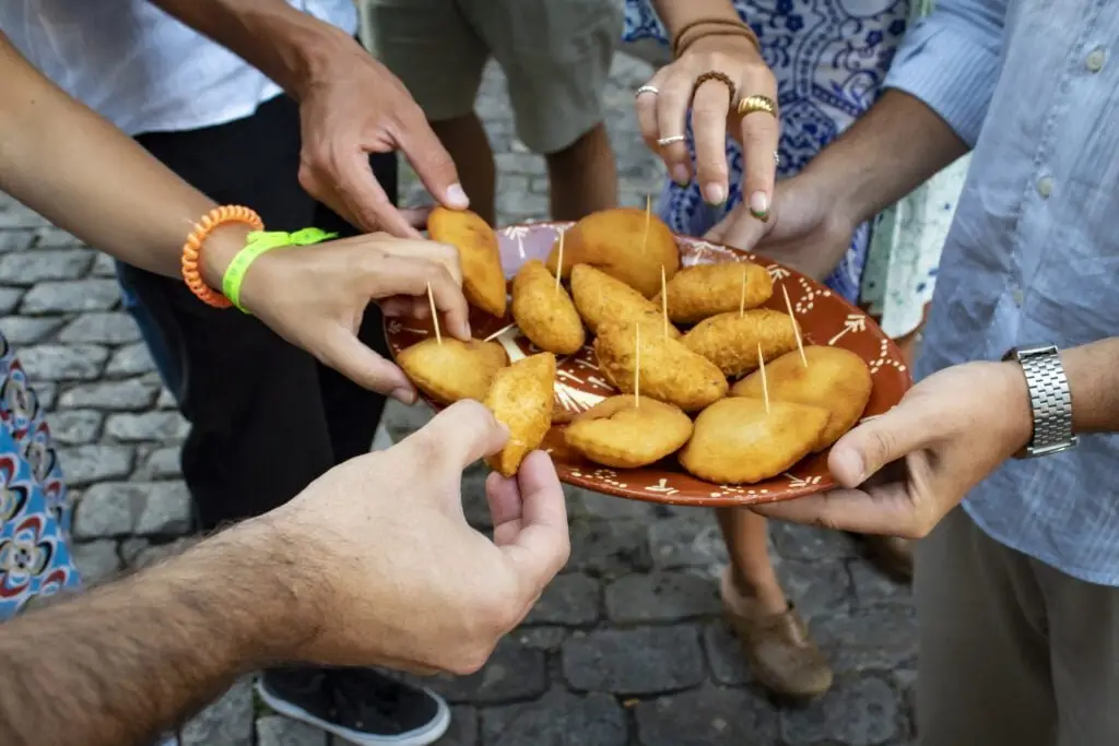 COME Food Tous Clients grabbing Rissóis and Bolinhos de Bacalhau - A very common Portuguese Snack that be served as a Snack or a Main Dish